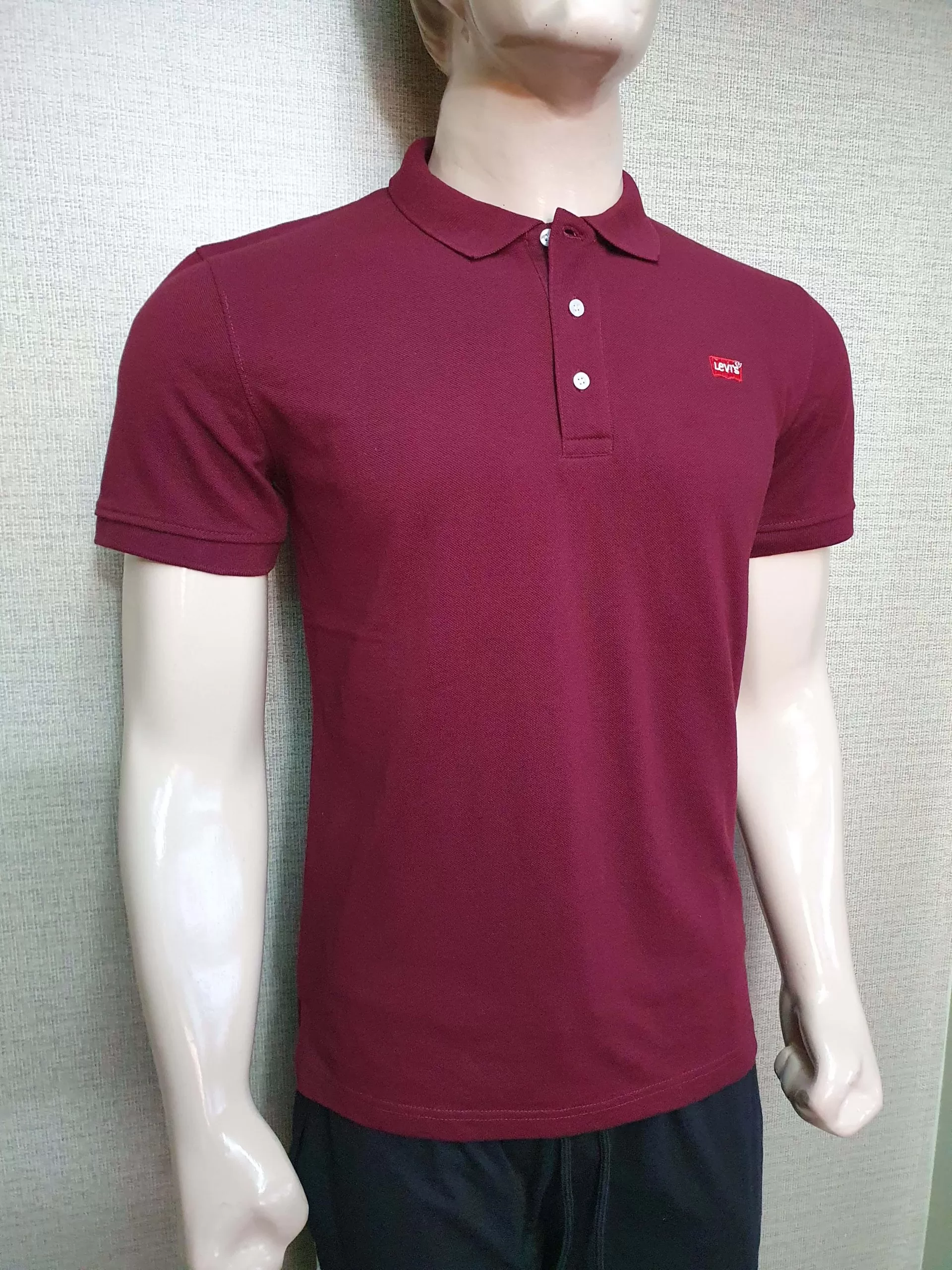 "Men's Levi's polo t-shirts displayed in a lineup"